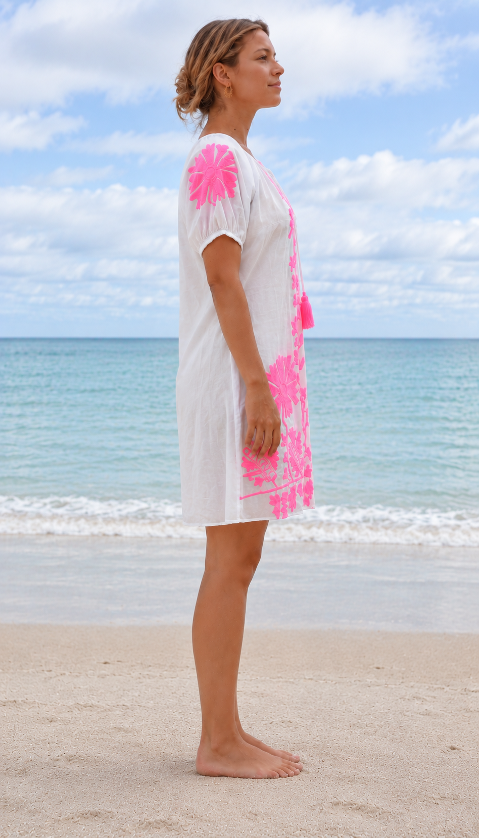 Jessie Embroidered Dress in White and Pink. Side view showing the loose fit.
