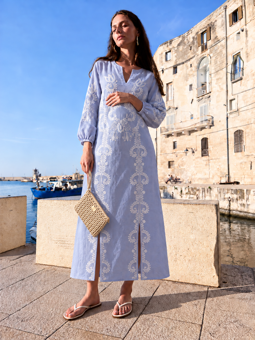 Sibel Denim — denim-blue maxi dress styled with the Bardot Light Gold clutch