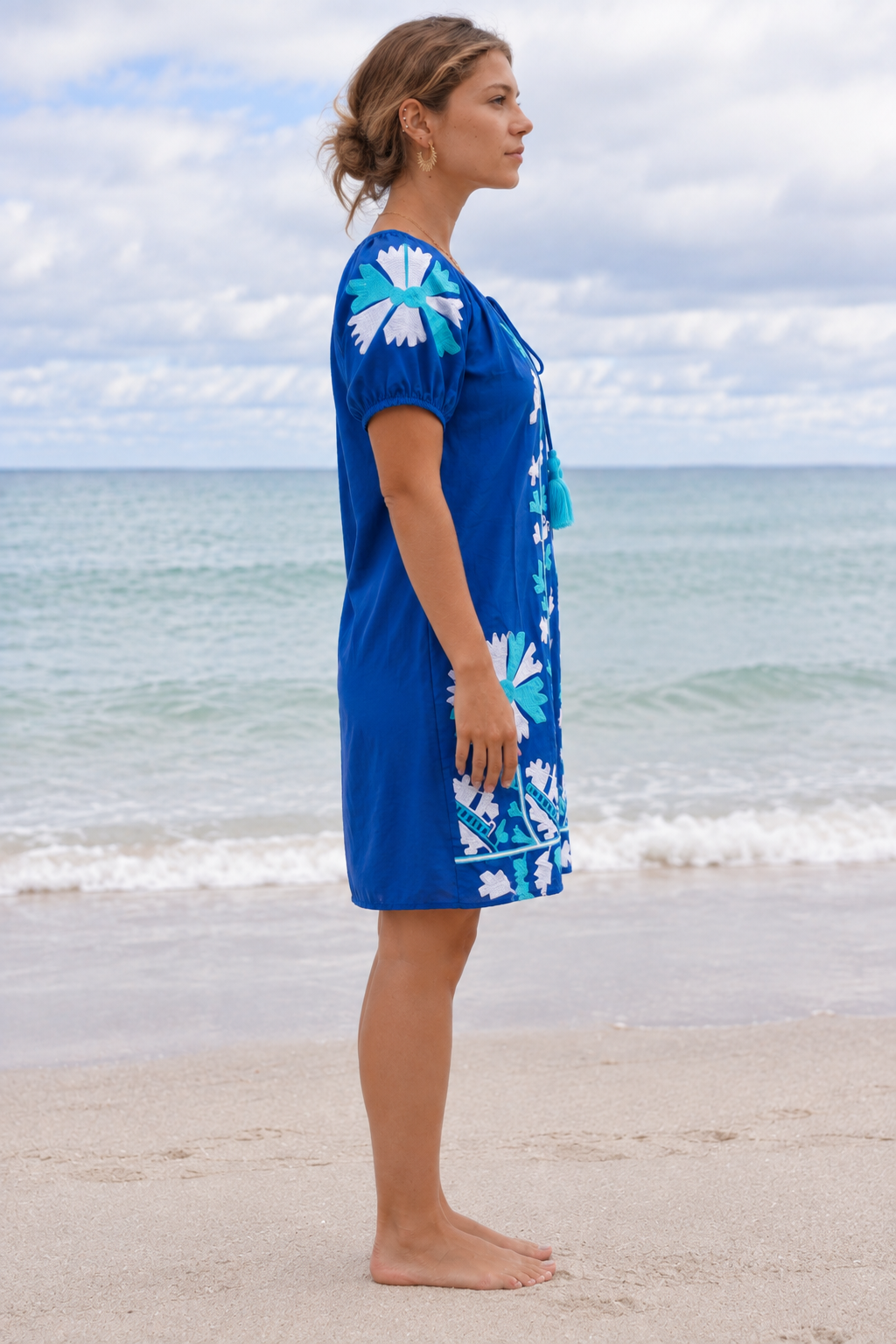 Jessie Embroidered Dress in Blue. Side view showing the short sleeves and loose fit.