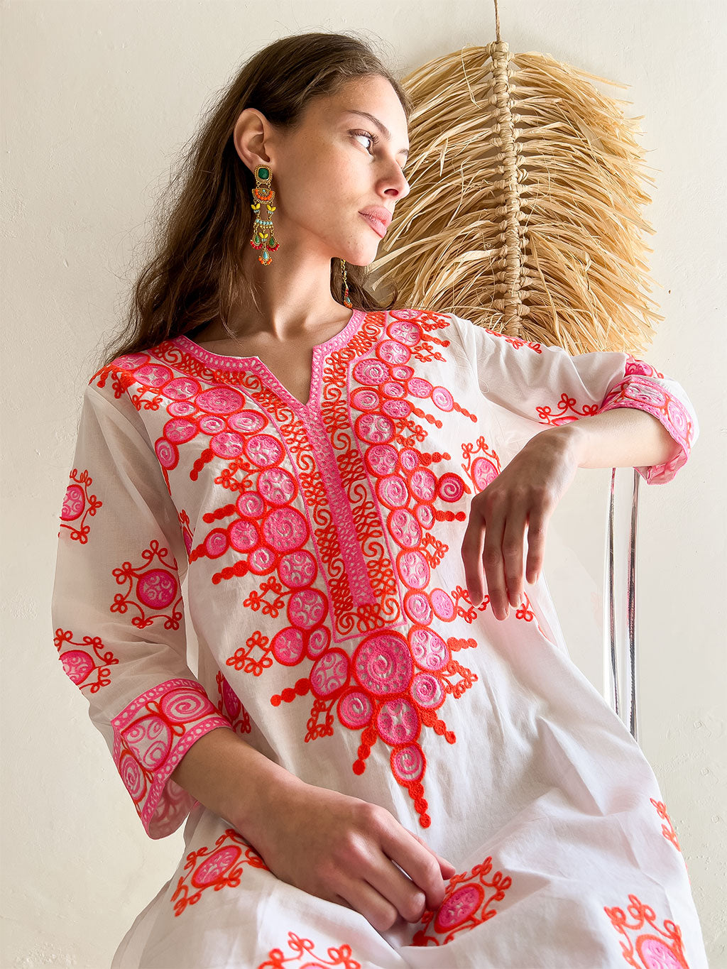 Emilia Embroidered Mini Dress in White. Close-up of neckline embroidery.